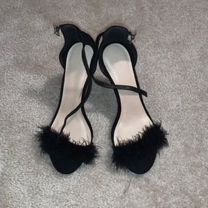Black high heels with feather detail